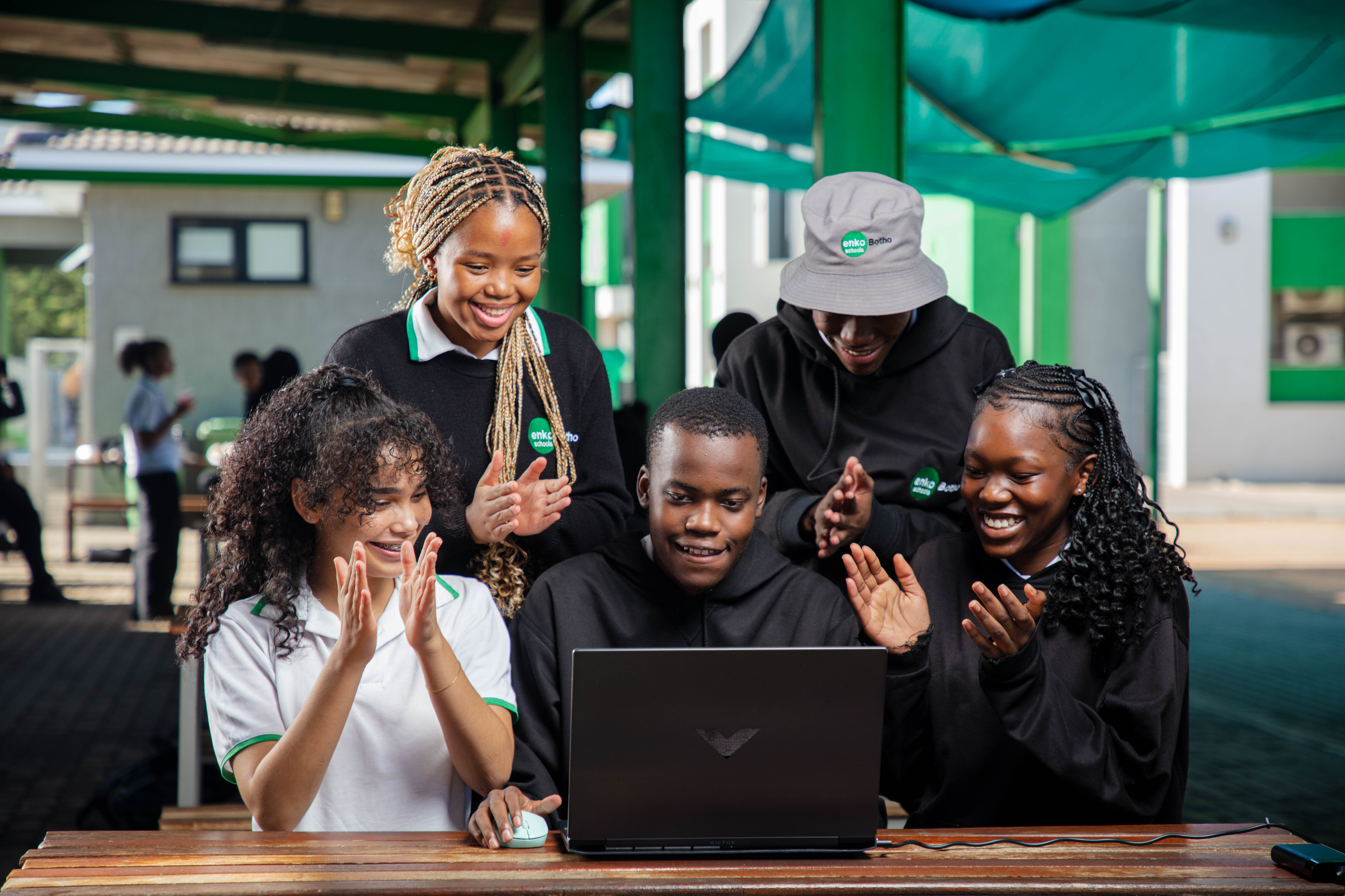 Enko Botho students with laptop